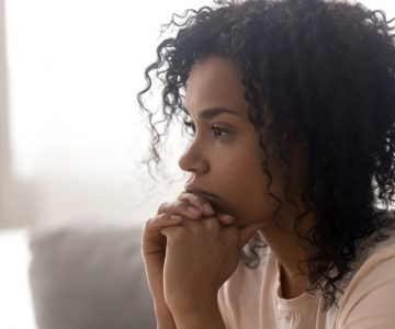 Close up of pensive black woman thinking having life troubles